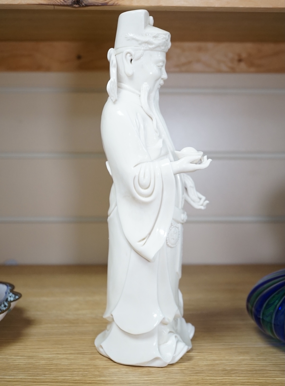 A Chinese blanc de chine Buddha figure, stamped to the reverse, 30cm high. Condition - Good